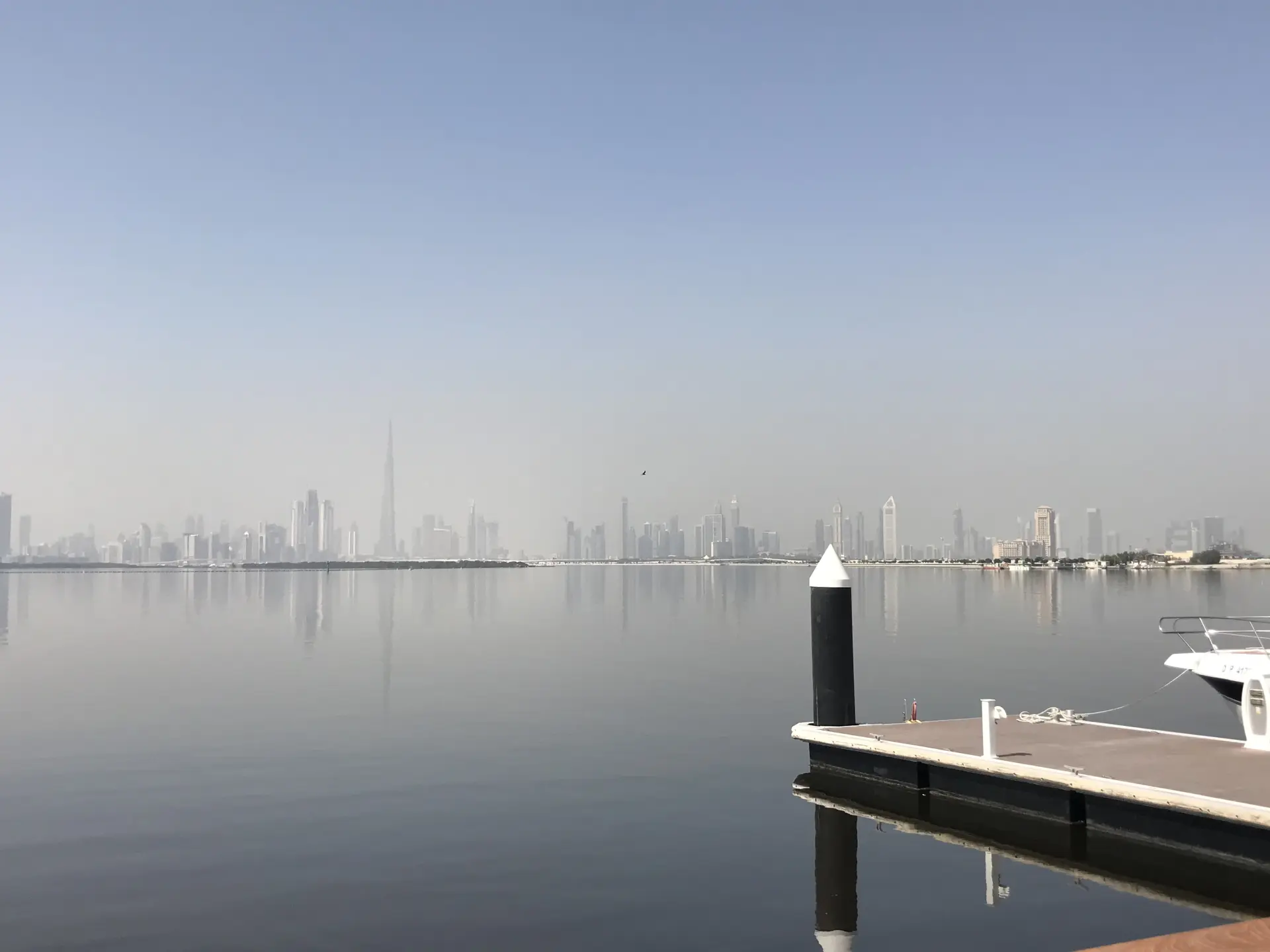 Downtown Dubai in the haze, seen across the water from Dubai Creek Harbour