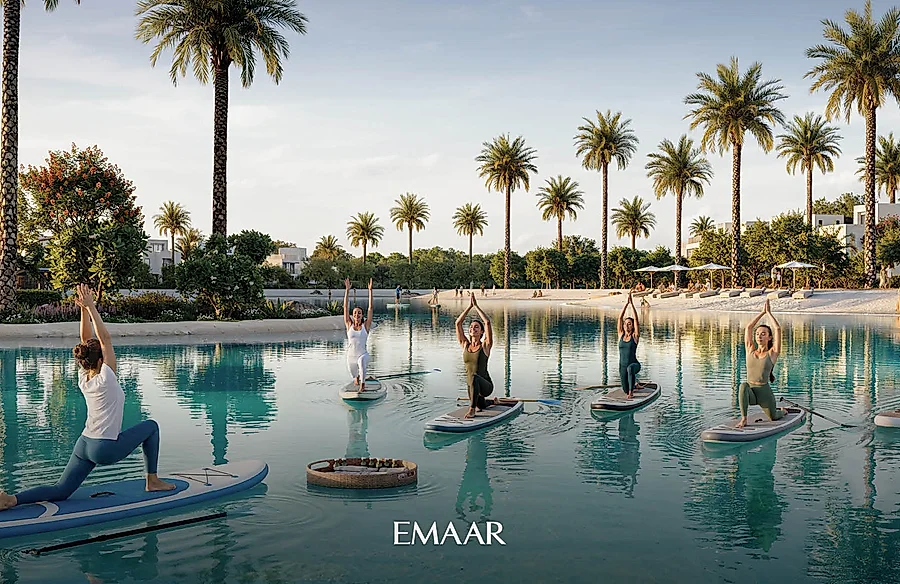 Emaar's render of people doing yoga on paddle boards on a lake lined with palms